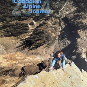 2015 Canadian Alpine Journal. Lead climber high above the trees below.